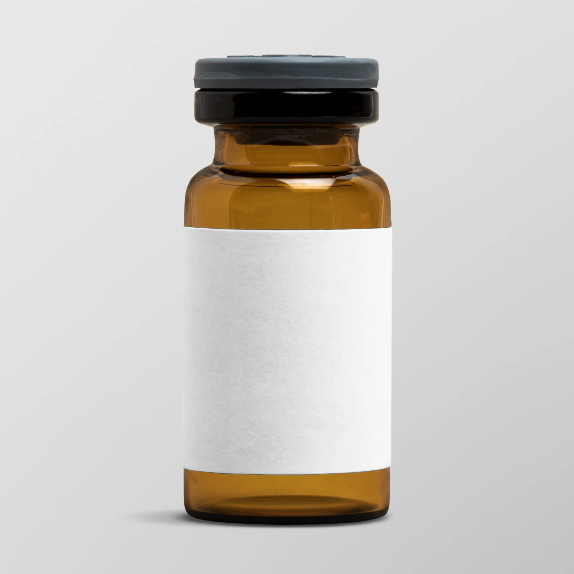 Amber glass vial with a blank white label, representing medication for ADHD treatment, relevant to Focalin (dexmethylphenidate) and addiction recovery support.