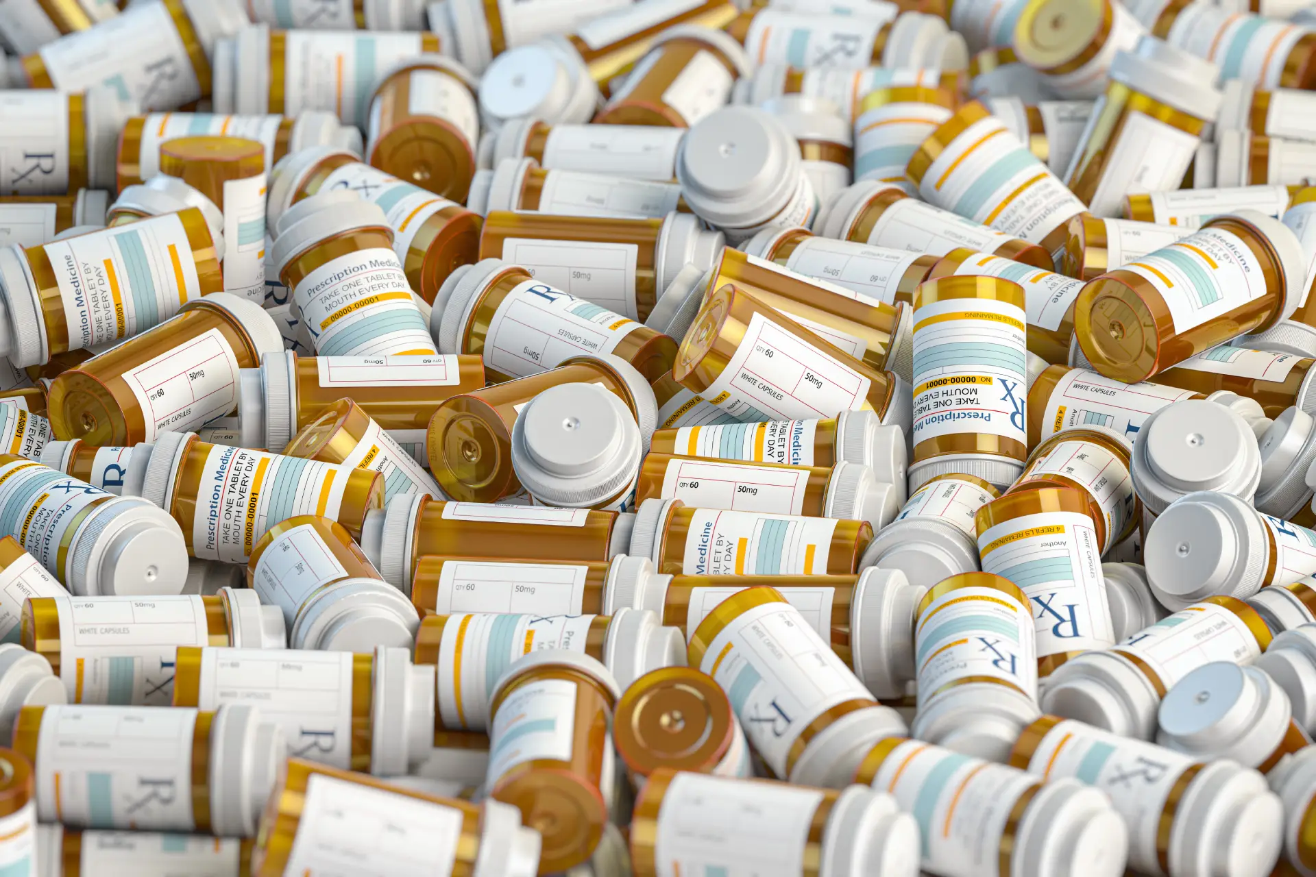 Prescription medication pill bottles stacked in disarray, highlighting the importance of responsible usage and the risks of dependence, relevant to addiction treatment and recovery discussions.
